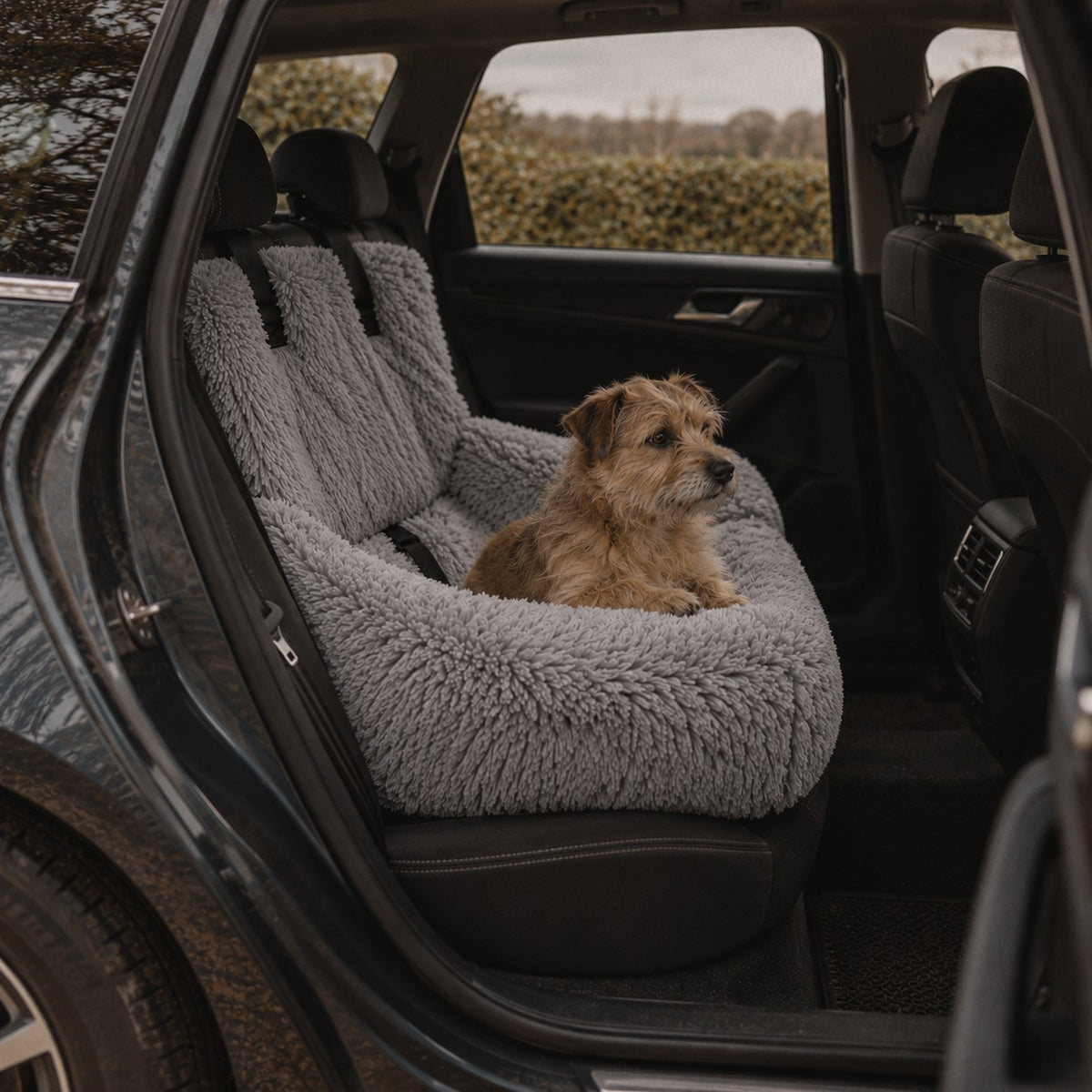 Verney raised dog car bed in grey on a car back seat | The Fernby